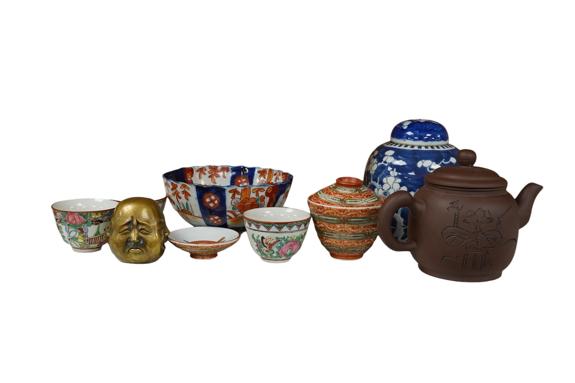 A Chinese Yixing teapot, a blue and white prunus jar, a Kutani tea bowl and two covers, other items, largest 15cm high